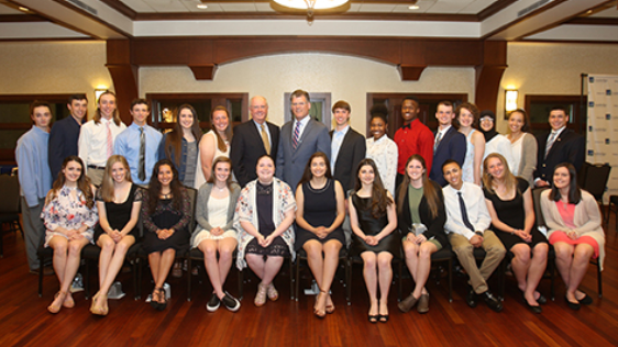 A group of scholarship recipients and CSB employees posing for the camera at an event