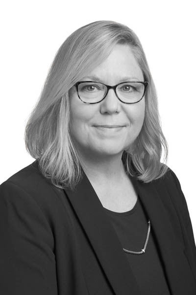 A black-and-white headshot of mortgage loan officer Jennifer Conroy
