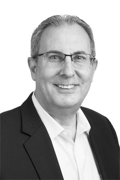 A black-and-white headshot of mortgage loan officer Ron Yorks