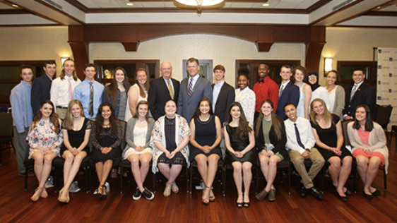 A group of scholarship recipients and CSB employees posing for the camera at an event