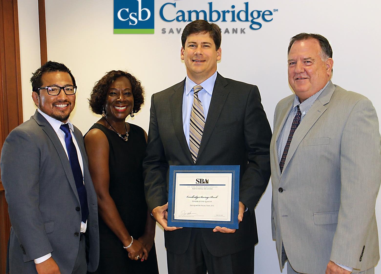 SBA's District Director Robert Nelson presenting the Lender of the Quarter Certificate to CSB