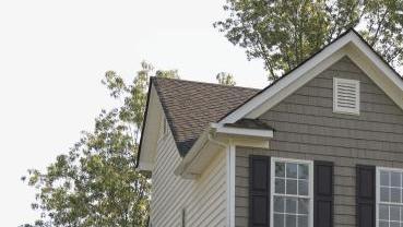 a house with green trees