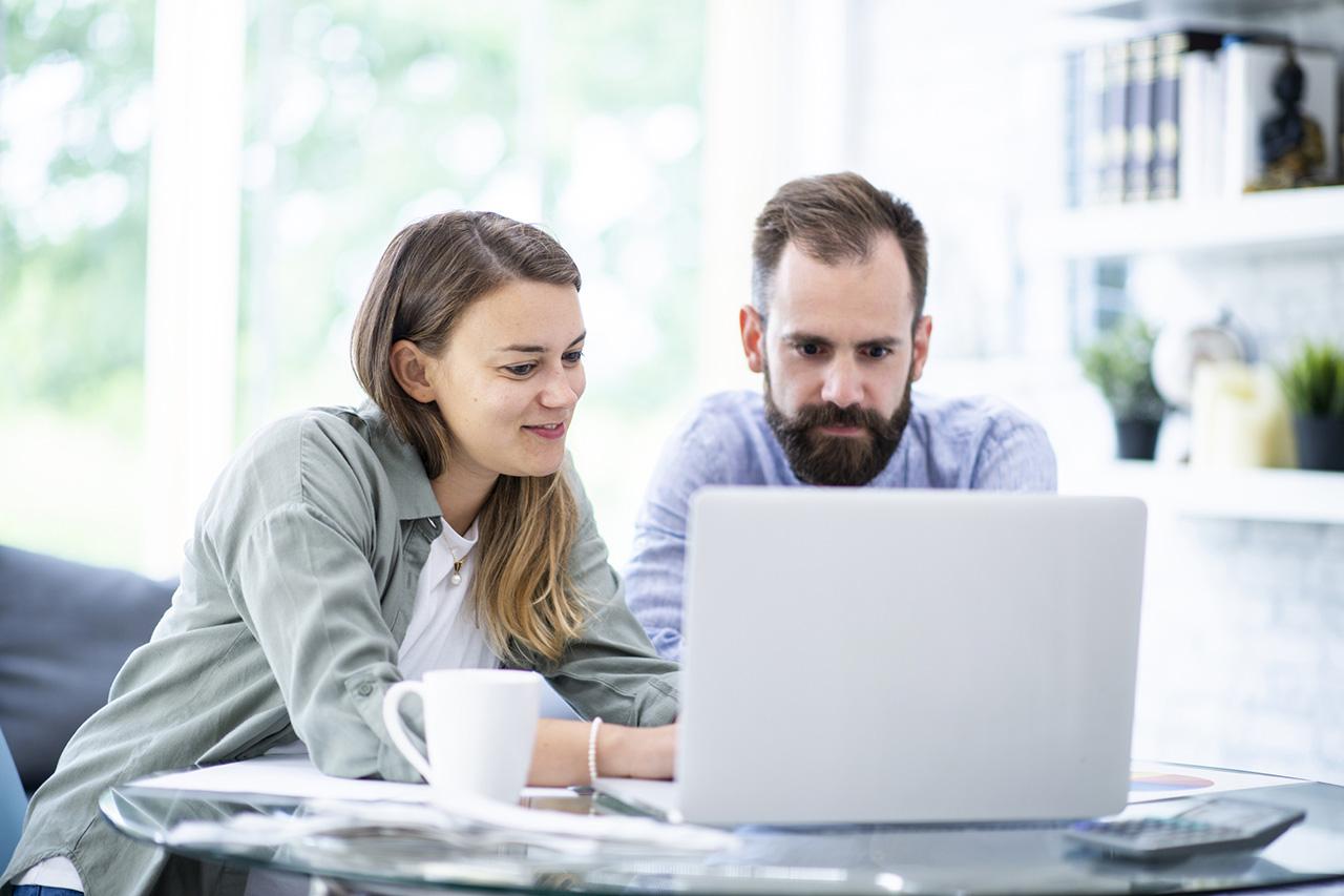 Couple in front of laptop