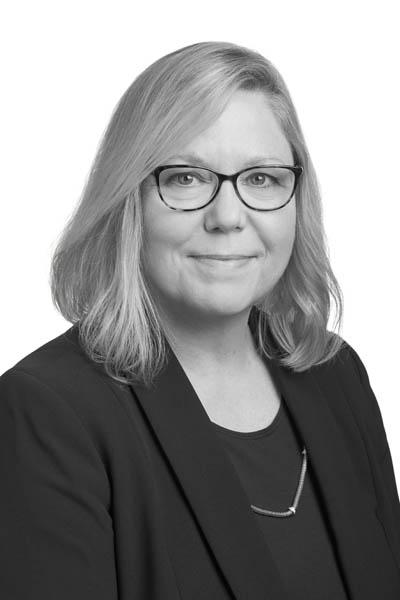 A black-and-white headshot of mortgage loan officer Jennifer Conroy
